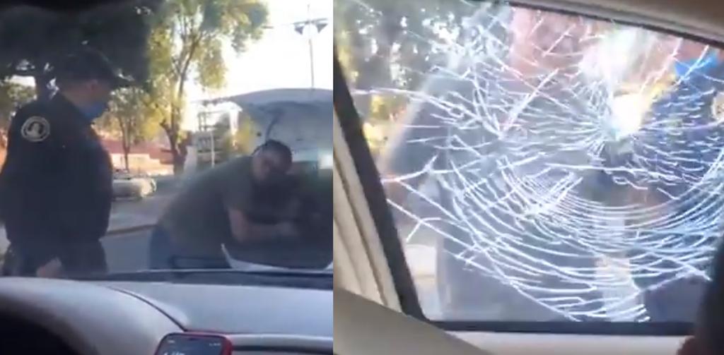 VIDEO: Taxista rompe ventanilla de otro vehículo frente a policía