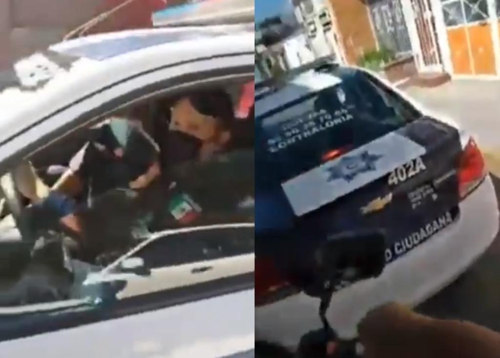 'Regrésale su teléfono'; captan a policías 'robando' celular a chofer de camión