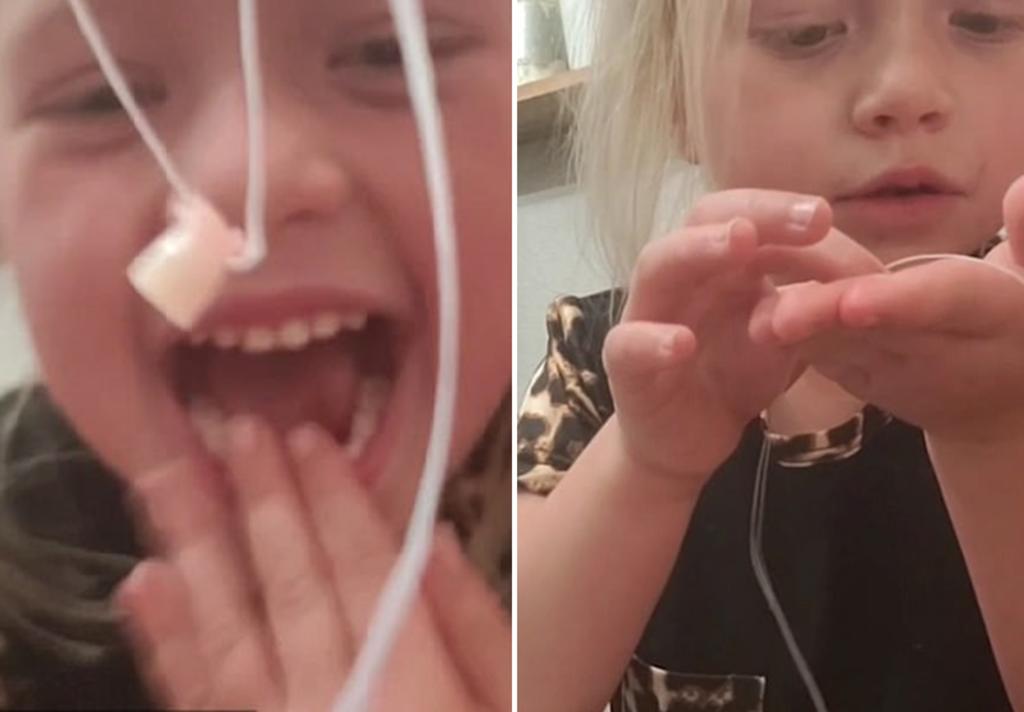 Niña de 5 años grita de alegría cuando le quitan un diente de leche flojo